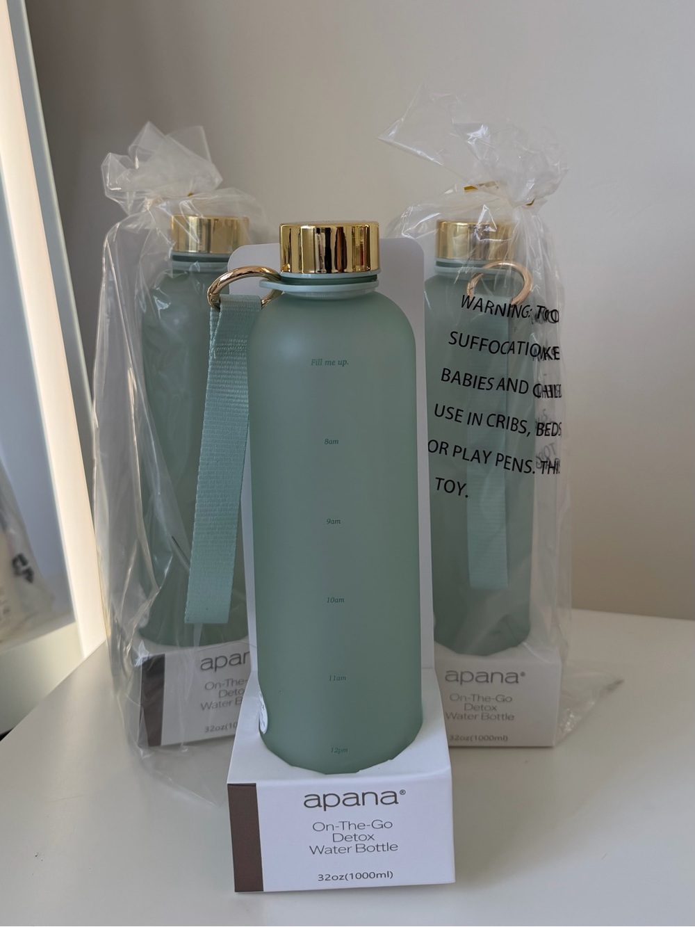 Water Bottle with Gold Cap and Strap